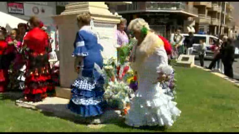 Misa y ofrenda floral de la feria de sevillanas